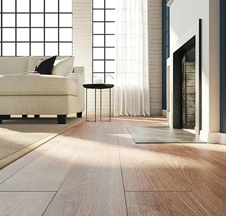 Sunlit modern living room featuring wide luxury vinyl plank flooring and minimalistic decor.