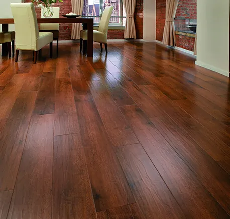 Bright living room featuring glossy laminate wood flooring and modern furniture.