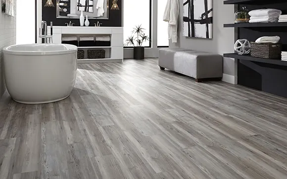 Stylish modern living room featuring gray luxury vinyl plank flooring with contemporary furniture.