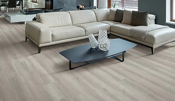 Modern living room featuring luxury vinyl plank flooring with light-colored furniture and stylish decor.
