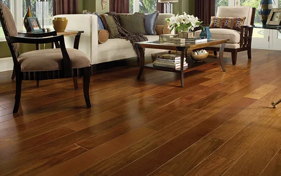 Elegant dining room showcasing warm hardwood flooring and traditional wooden chairs.