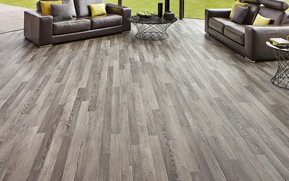 Contemporary living room with dark grey luxury vinyl plank flooring and modern furniture.